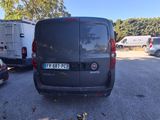 the back of a black van parked in a parking lot