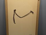 an old picture of a piece of art with a handle on it