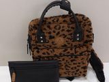 leopard print handbag and wallet on a white surface