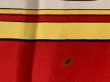a close up of a red and yellow towel with a yellow stripe