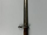 a picture of a knife hanging on a wall