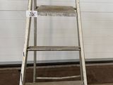 a ladder that is leaning against a wall in a garage