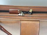 a close up of a suitcase with a key in it