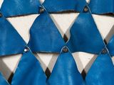 a close up of the back of a blue and white dress