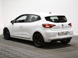 the rear end of a white car in a room with a checkered floor