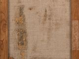 an old picture of a piece of wood with a piece of paper on it