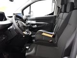 the interior of a van with the driver ' s seat folded down