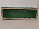 an image of a green and white box on a table