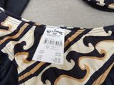 the back of a bathing suit with a tag on it