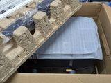 a cardboard box that has a bunch of luggage inside of it