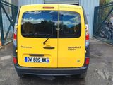 a yellow van that is parked in a parking lot