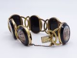 a bracelet that has a picture of a woman on it