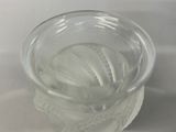 a glass of water with ice in it on a table
