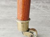 a close up of a wooden umbrella with a metal handle