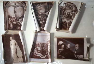 many old photos hanging on the wall of a room