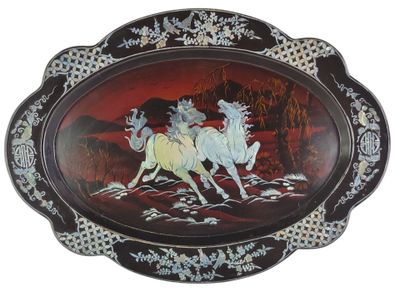 a picture of a plate with a painting of two horses on it