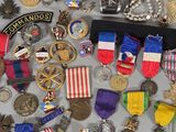 a lot of medals and medals on a table