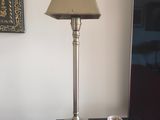 a lamp that is sitting on a table next to a mirror