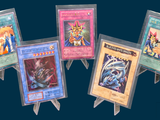 four cards on a small easer on a blue background