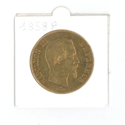 une pièce d'or sur laquelle figure l'image d'un homme