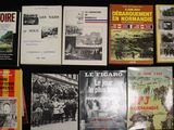several books on a black table with a black background