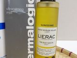 a bottle of dermacgic and a box of sunscreen