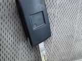 a car key attached to the back seat of a car