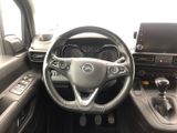 the interior of a car with a steering wheel and dashboard controls