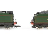 two trains that are sitting side by side on a white surface