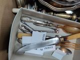 a box full of silverware and silverware in it