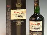 an image of a bottle of rumm j m whisky next to a box