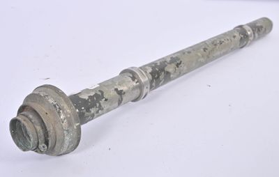 a metal pipe that is sitting on a table