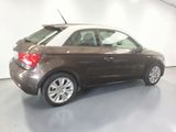 a picture of a brown car in a garage