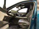 the interior of a car with the door open and the driver ' s seat down
