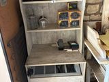 a shelf that has a bunch of items on it