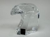 a glass sculpture of a bird on a white surface