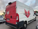 a red and white van that is parked in a parking lot