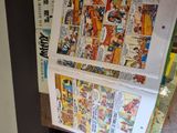 a bunch of comics on a shelf in a store