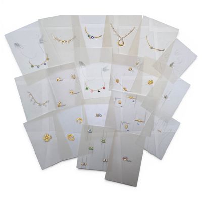 many different types of necklaces and bracelets on display