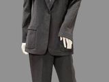 a mannequin wearing a suit and tie on a mannequin head