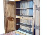 a wooden cabinet with a door open on a hard wood floor