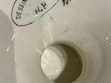 a close up of a white toilet with the lid down