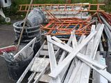 a pile of construction materials sitting outside of a building