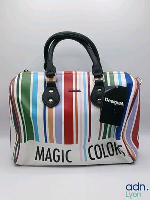 a multicolored bag with a tag on it