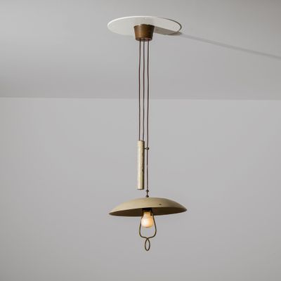 a close up of a light fixture hanging from a ceiling