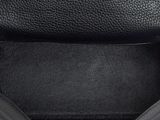 the inside of a black leather bag with a zipper on it
