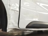 a close up of a car ' s front bumper and fender