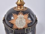 a black and gold helmet with a gold star on it
