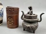 three different types of vases and a teapot sitting next to each other