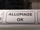 an image of a sign on a refrigerator in a kitchen